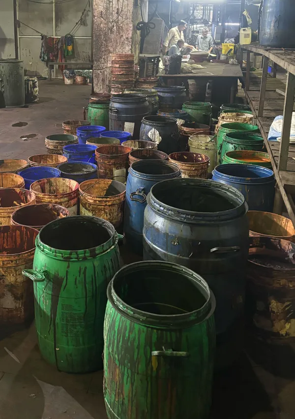 Dye chemical drums on the dyeing floor at Bindal Silk Mills